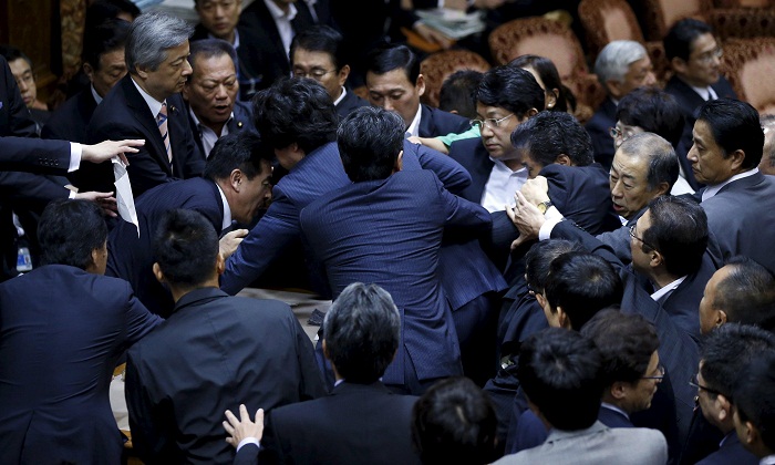 Brawl starts in Japanese parliament over controversial security bill - VIDEO